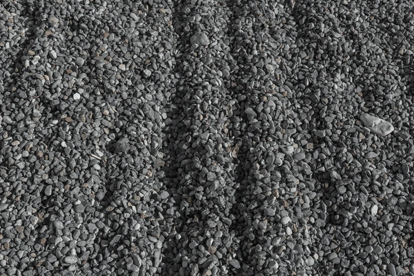 Close-up of multi-coloured crushed rock used in road and driveway construction