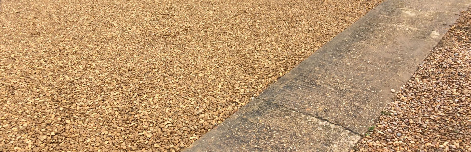 Road and driveway construction with heavy equipment